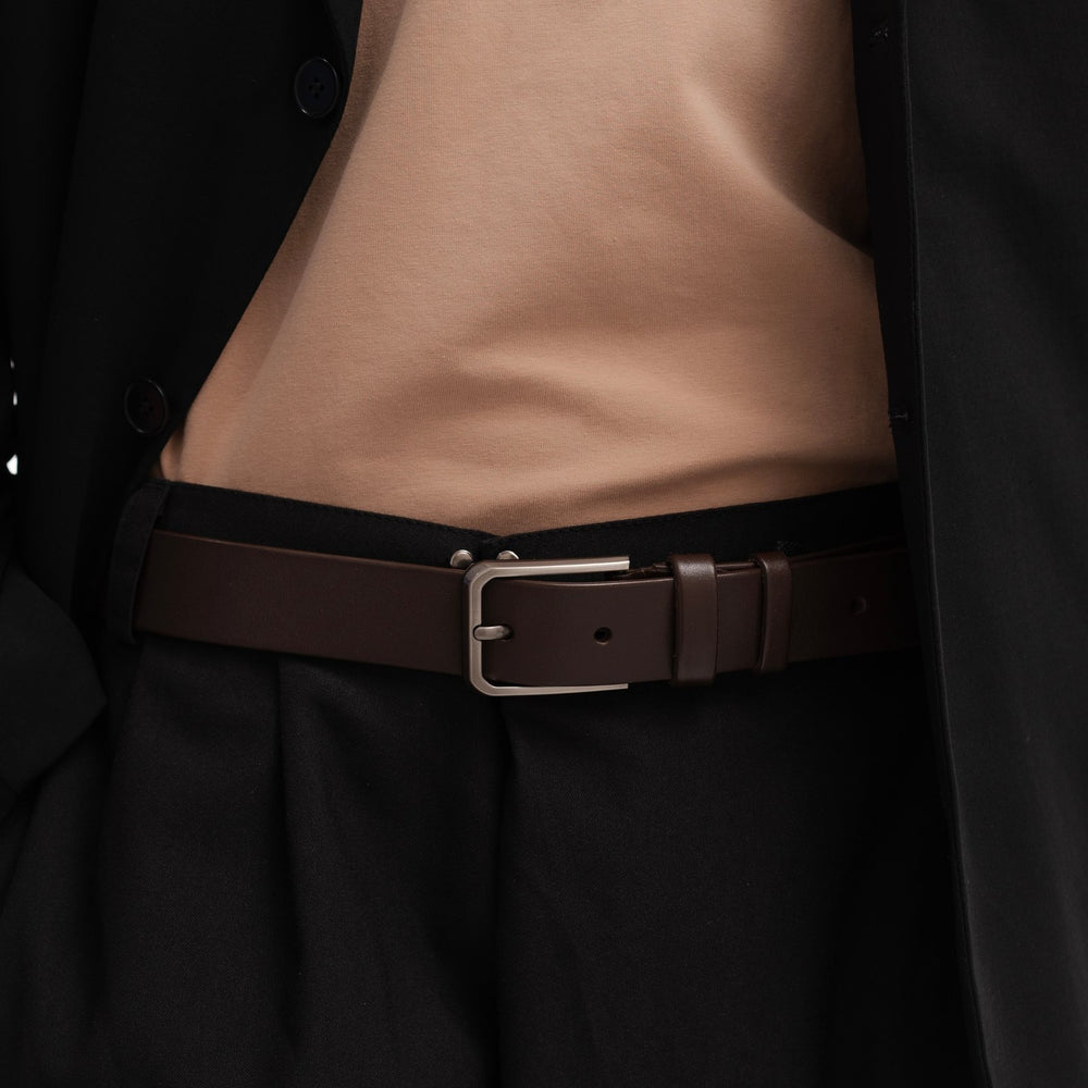 Brown leather belt with gray buckle