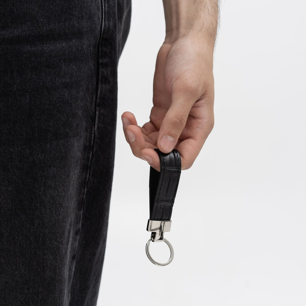 Keychain made of black crocodile leather