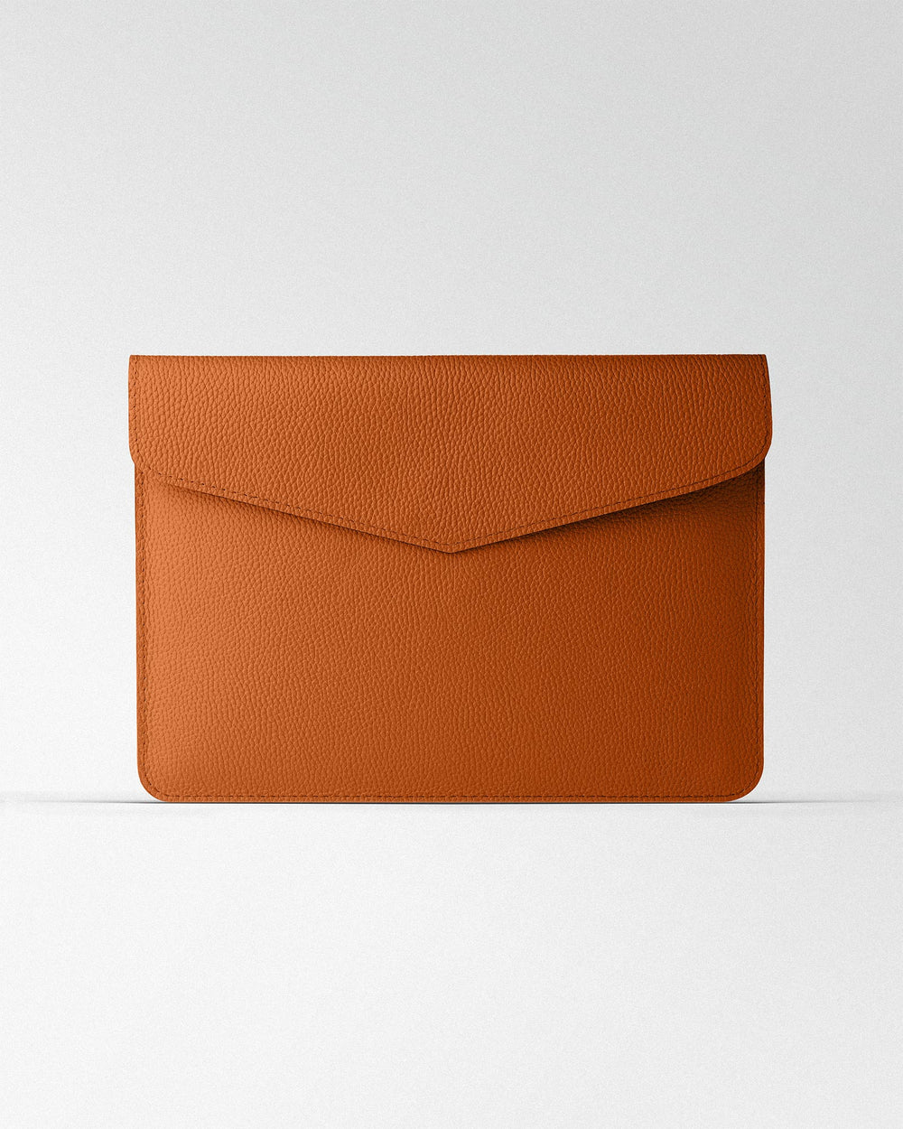 Magnetic Envelope Case made of orange textured leather for MacBook