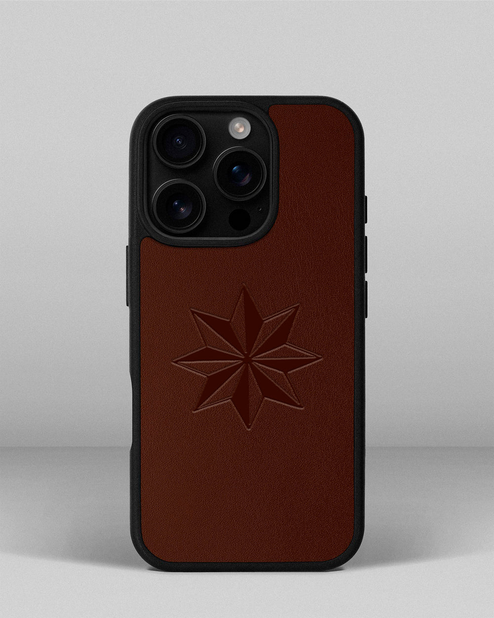 Чохол для iPhone 14 Pro із шкіри купон в рудому кольорі з тисненням Роза вітрів