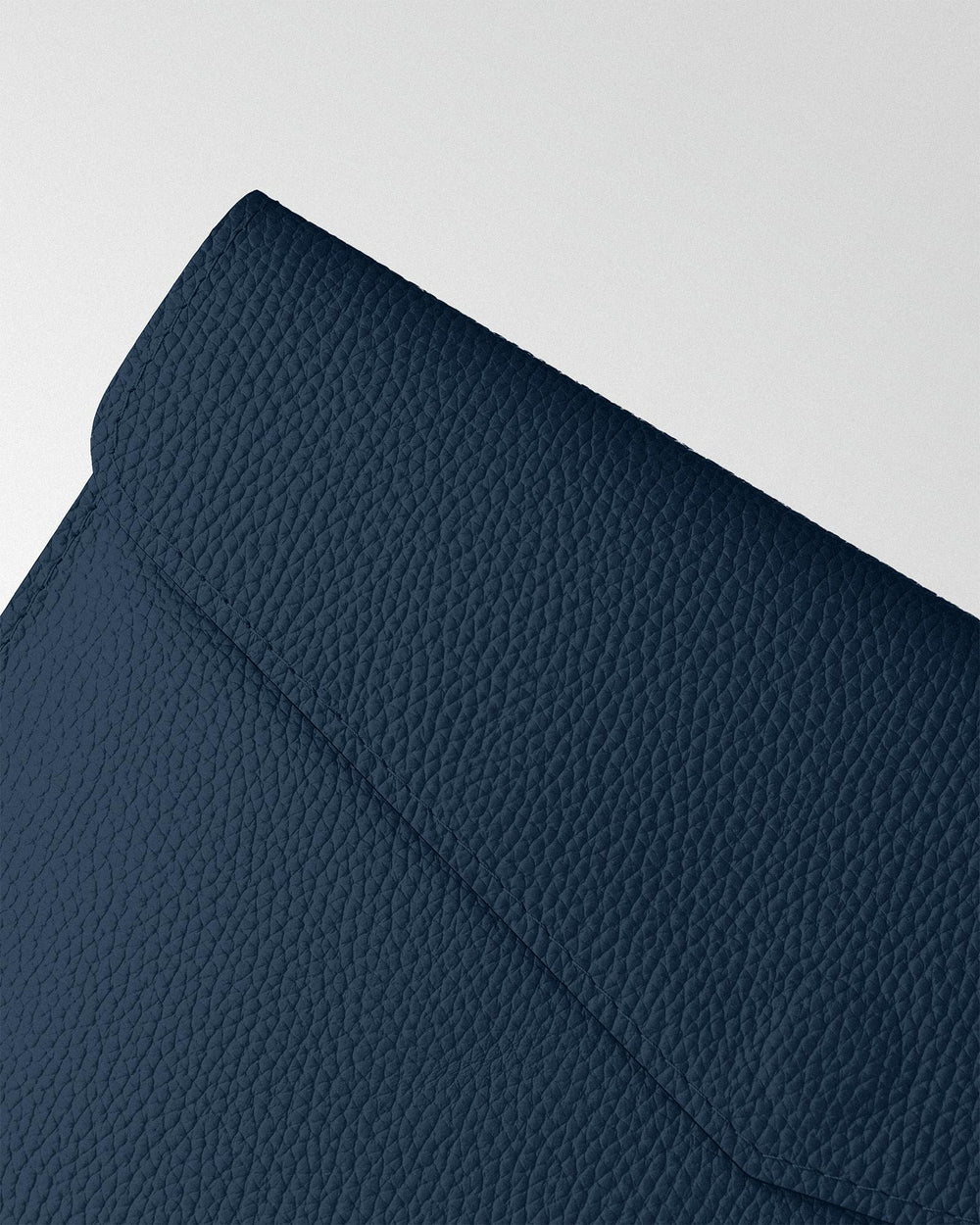 Magnetic Envelope Case made of dark blue textured leather for MacBook