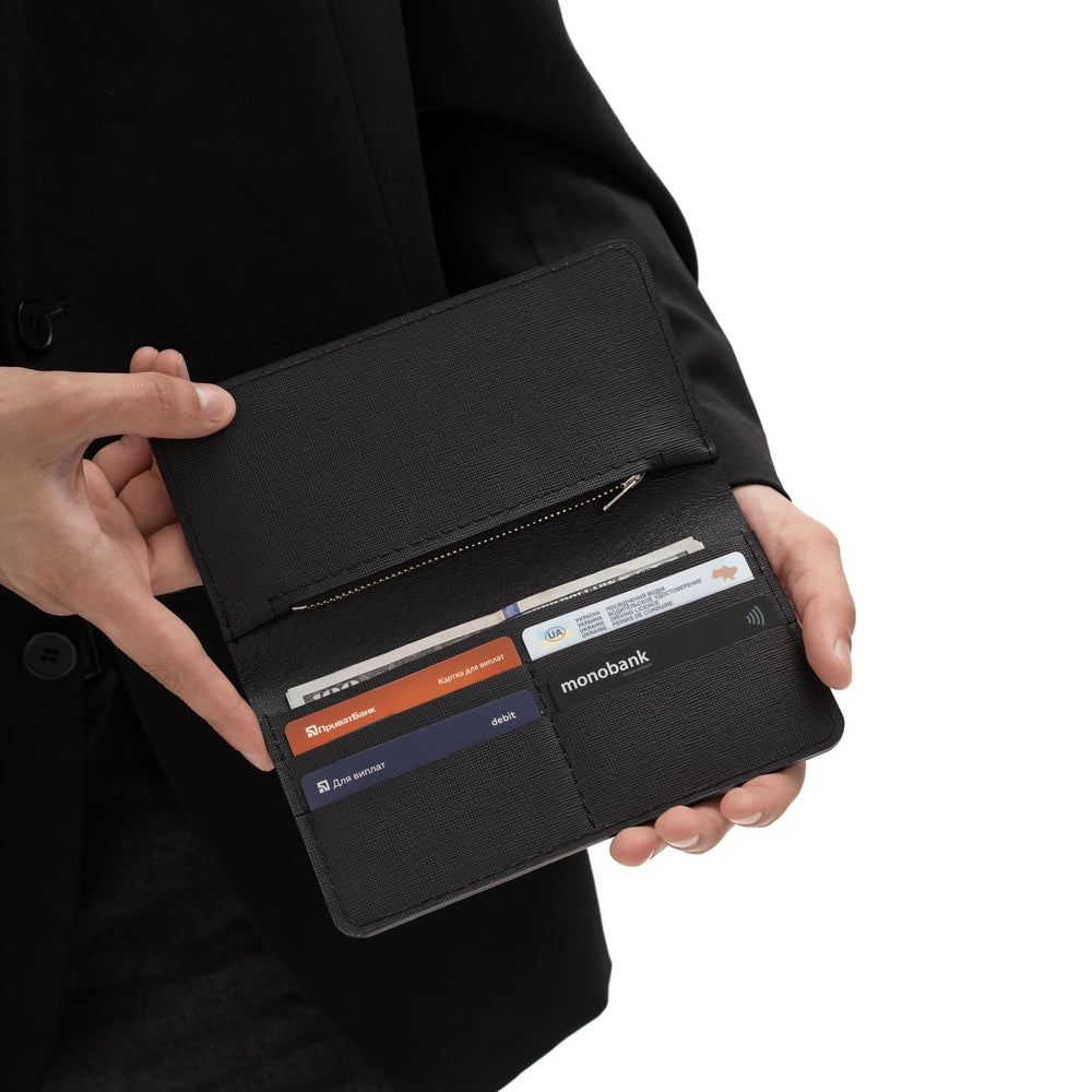 Wallet made of black python leather with wide scales