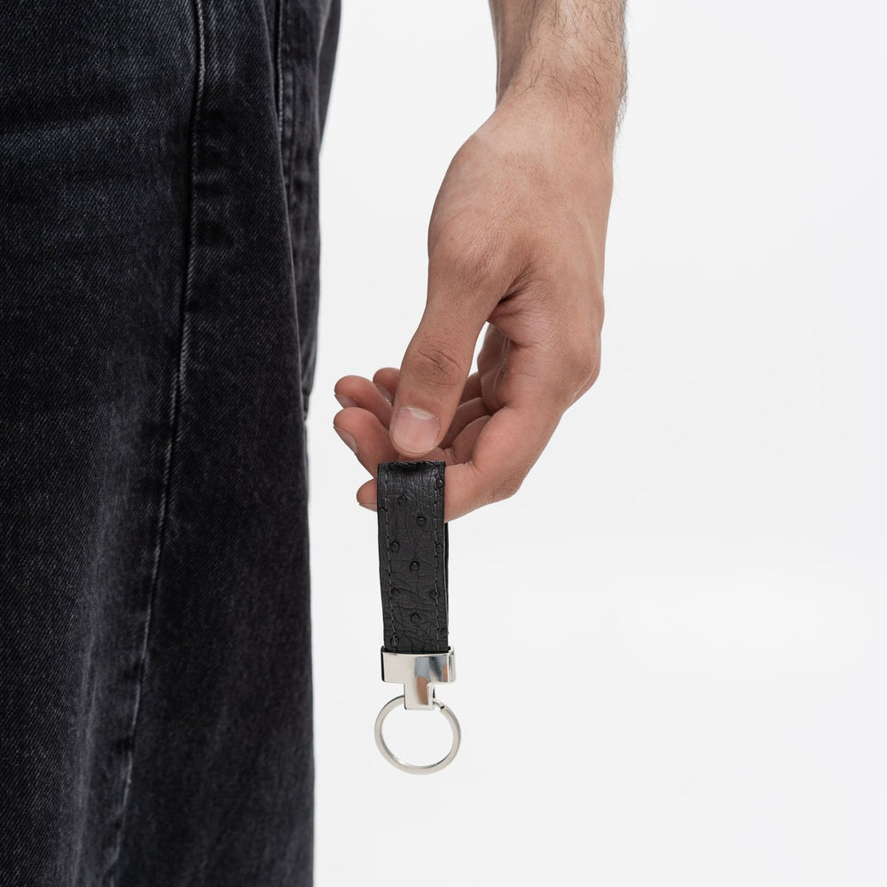 Keychain made of black ostrich leather with follicles
