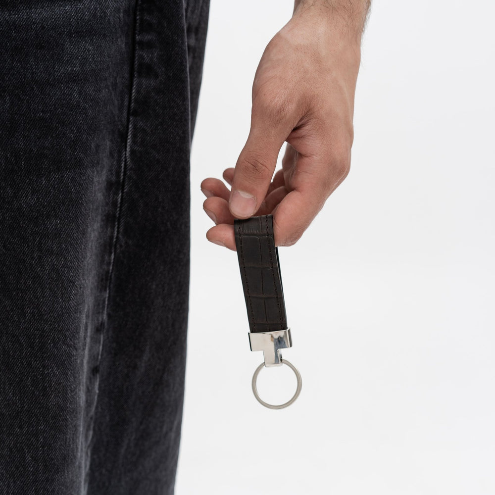 Keychain made of dark brown crocodile embossed leather