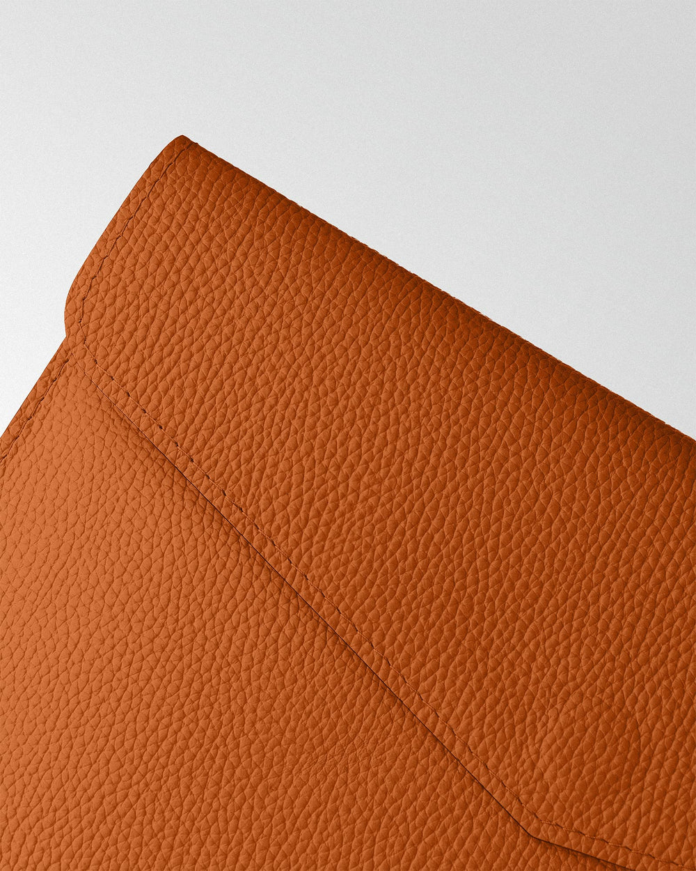 Magnetic Envelope Case made of orange textured leather for MacBook